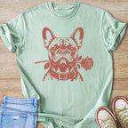 Light green t-shirt with a red graphic of a French bulldog holding a rose in its mouth.