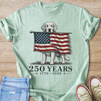 Golden retriever holds American flag with text "250 YEARS 1776-2026".