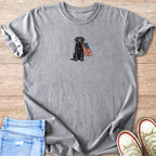 Grey graphic t-shirt with a black lab holding an American flag in its mouth.