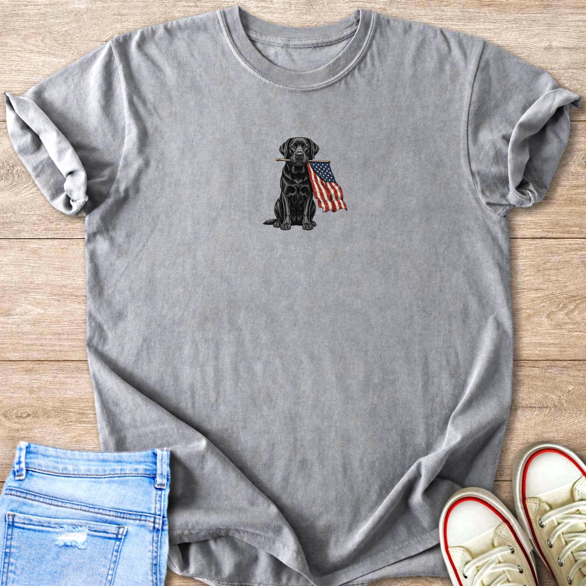 Grey graphic t-shirt with a black lab holding an American flag in its mouth.