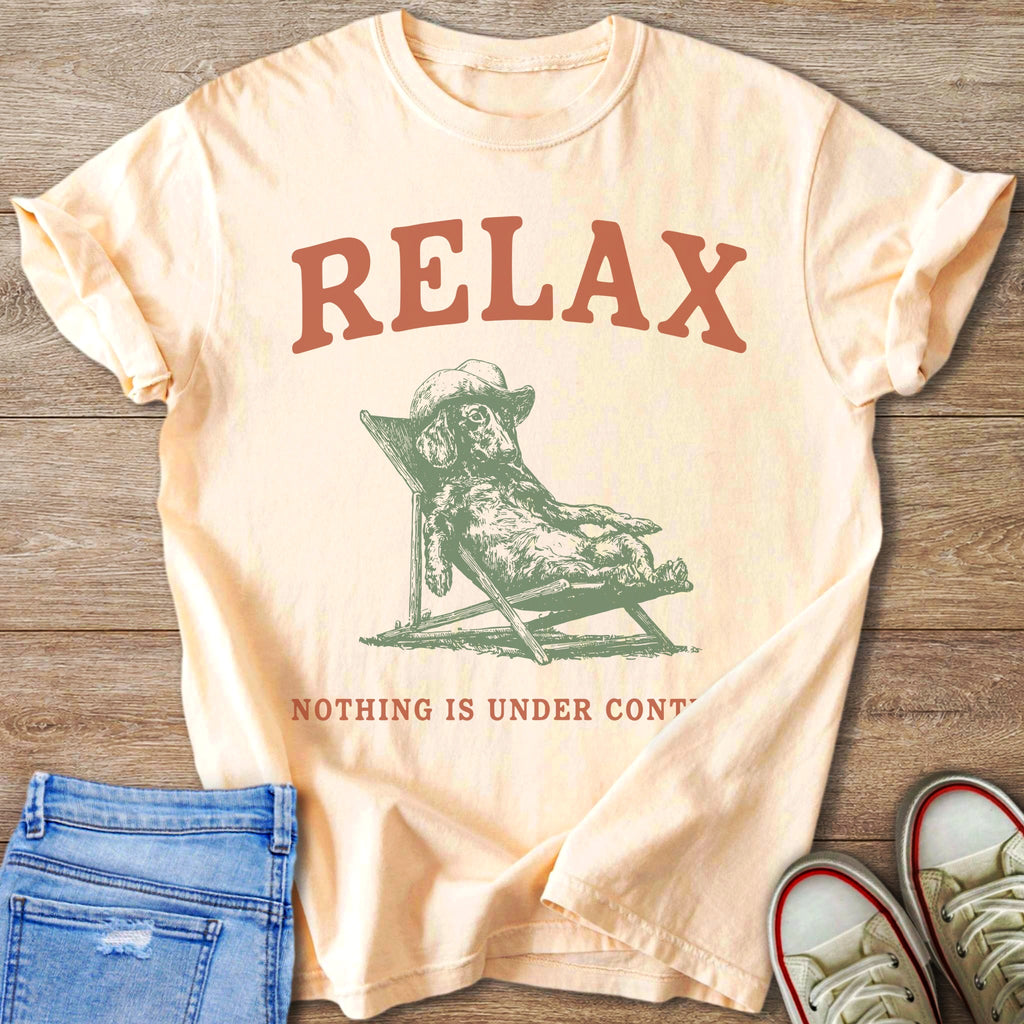 Peach t-shirt with "RELAX" and a dachshund lounging in a chair.