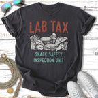 Dark t-shirt with "LAB TAX SNACK SAFETY INSPECTION UNIT" and cartoon snacks.