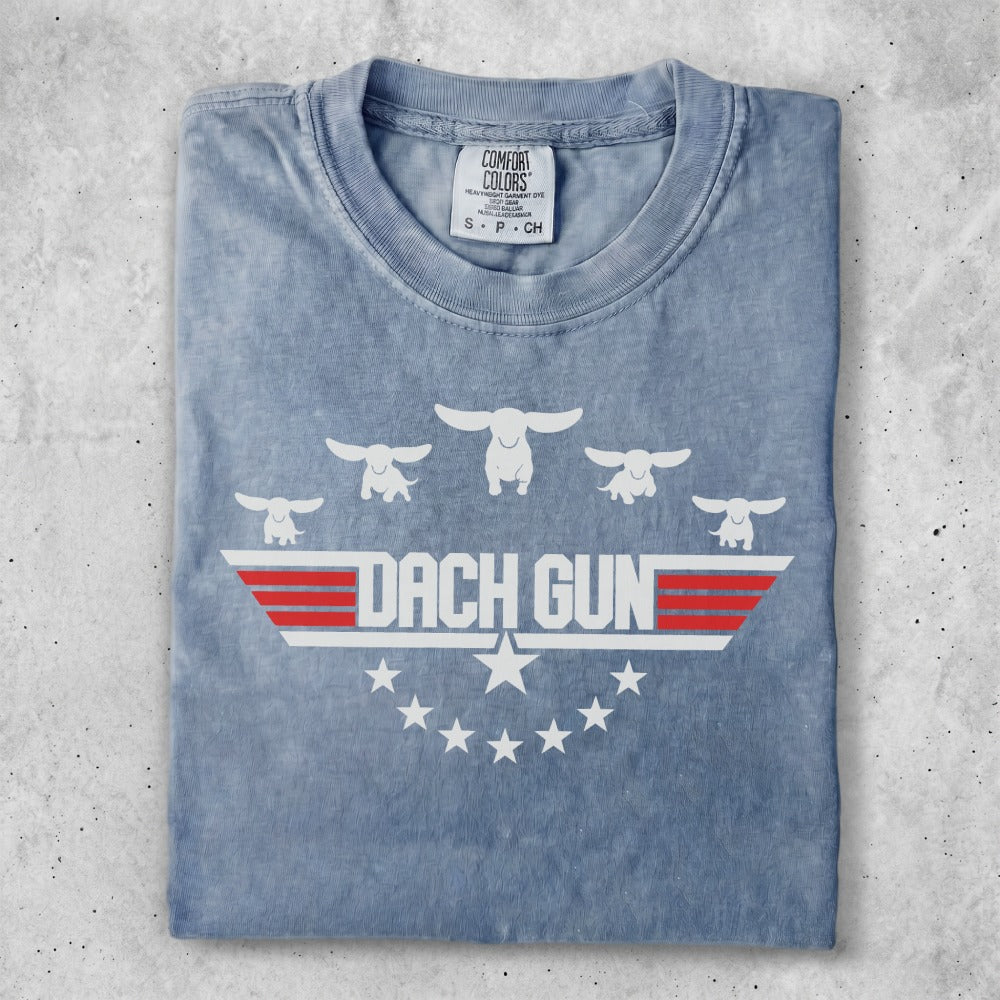 T-shirt with "DACH GUN" text and five stylized flying figures.