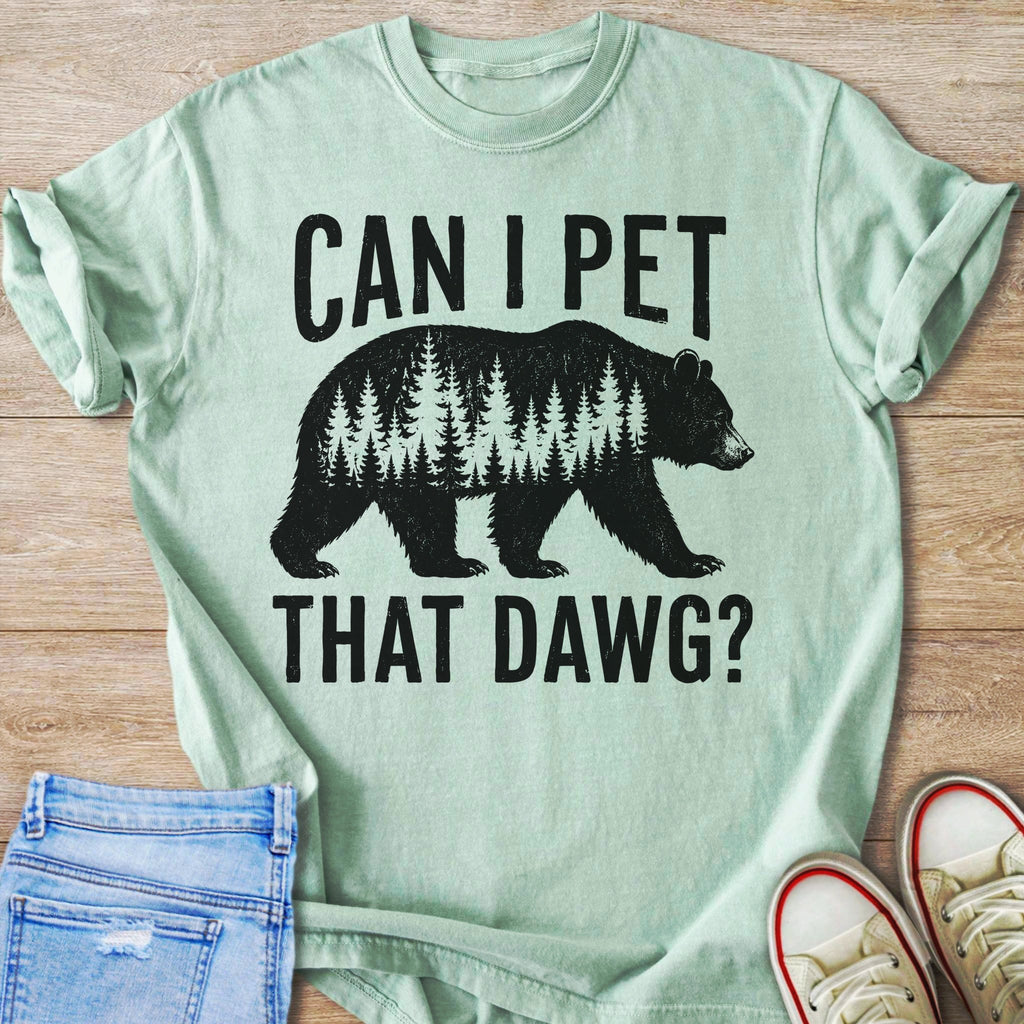 Light green t-shirt with black graphic of a bear made of trees and text.