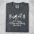 Dark grey t-shirt with mountains, trees, sun, and "If It Involves A Dog and Hiking Count Me in".