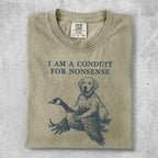 Golden retriever sitting with a goose, text reads "I AM A CONDUIT FOR NONSENSE".