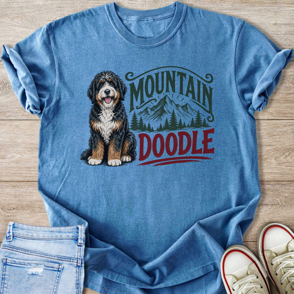 Bernese Mountain Doodle sitting next to text that reads "Mountain Doodle"