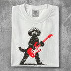 Black dog with red electric guitar printed on white t-shirt.