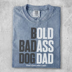 Comfort Colors t-shirt with "BOLD BADASS DOG DAD that's just who I am!" text.