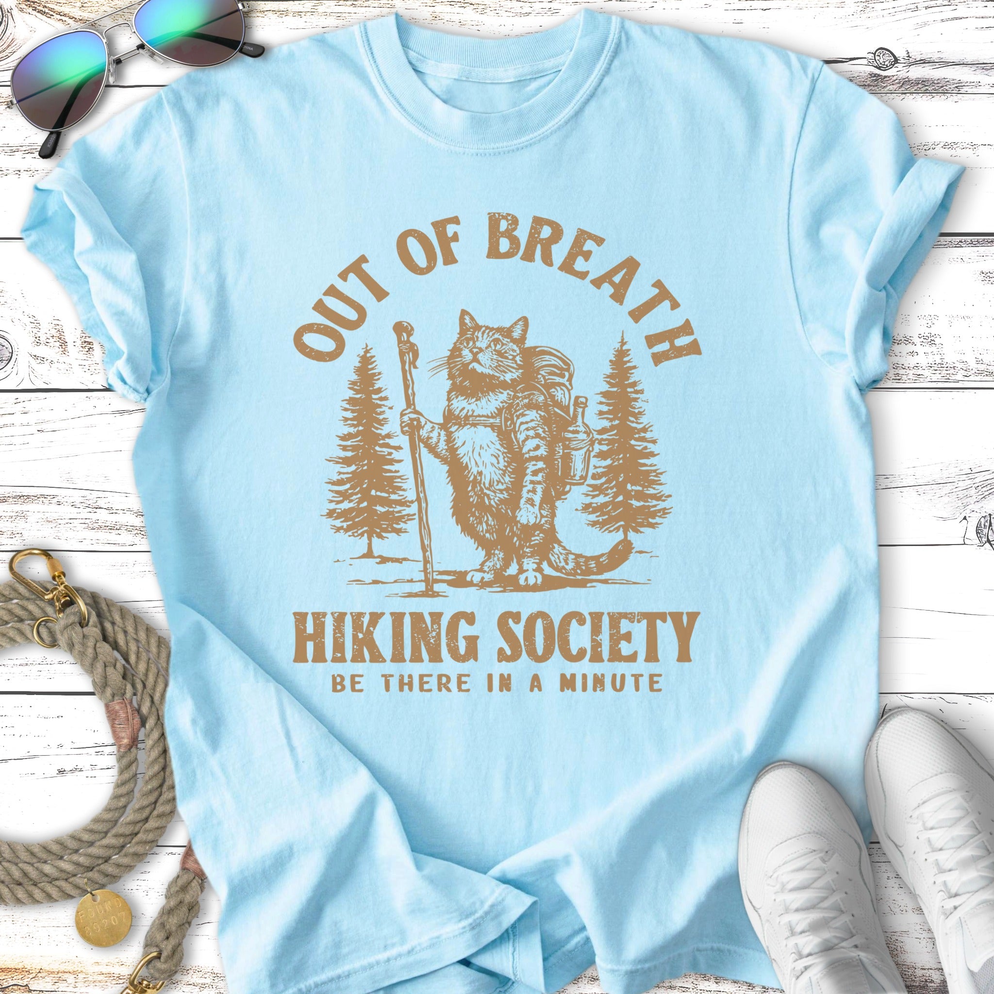 Cat hiking with backpack and walking stick, "Out of Breath Hiking Society" text.
