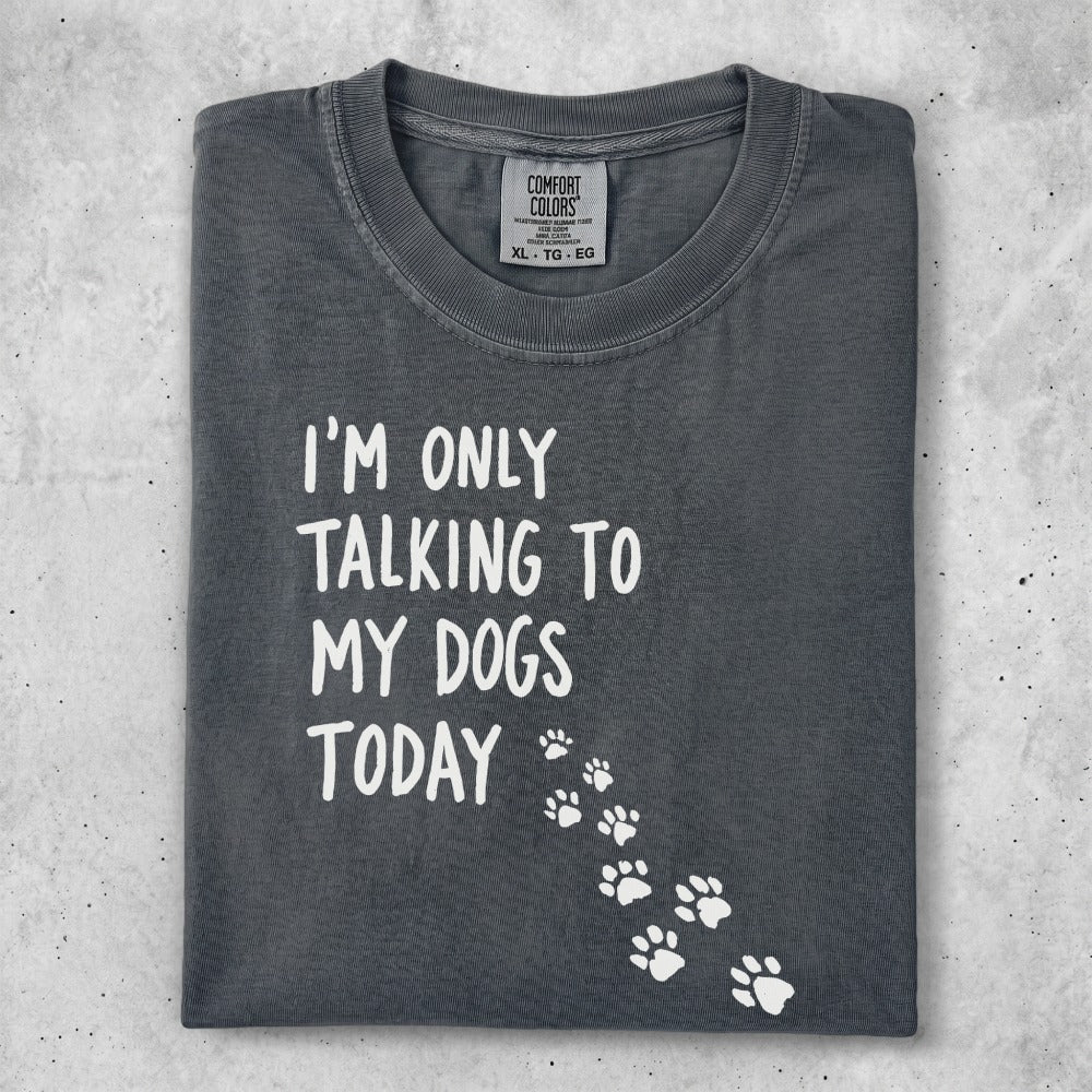 T-shirt with "I'm only talking to my dogs today" text and paw prints.