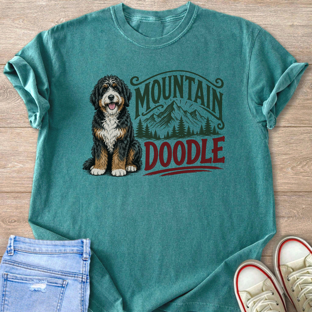 Bernese Mountain Doodle dog with "Mountain Doodle" text and mountain graphic on shirt.