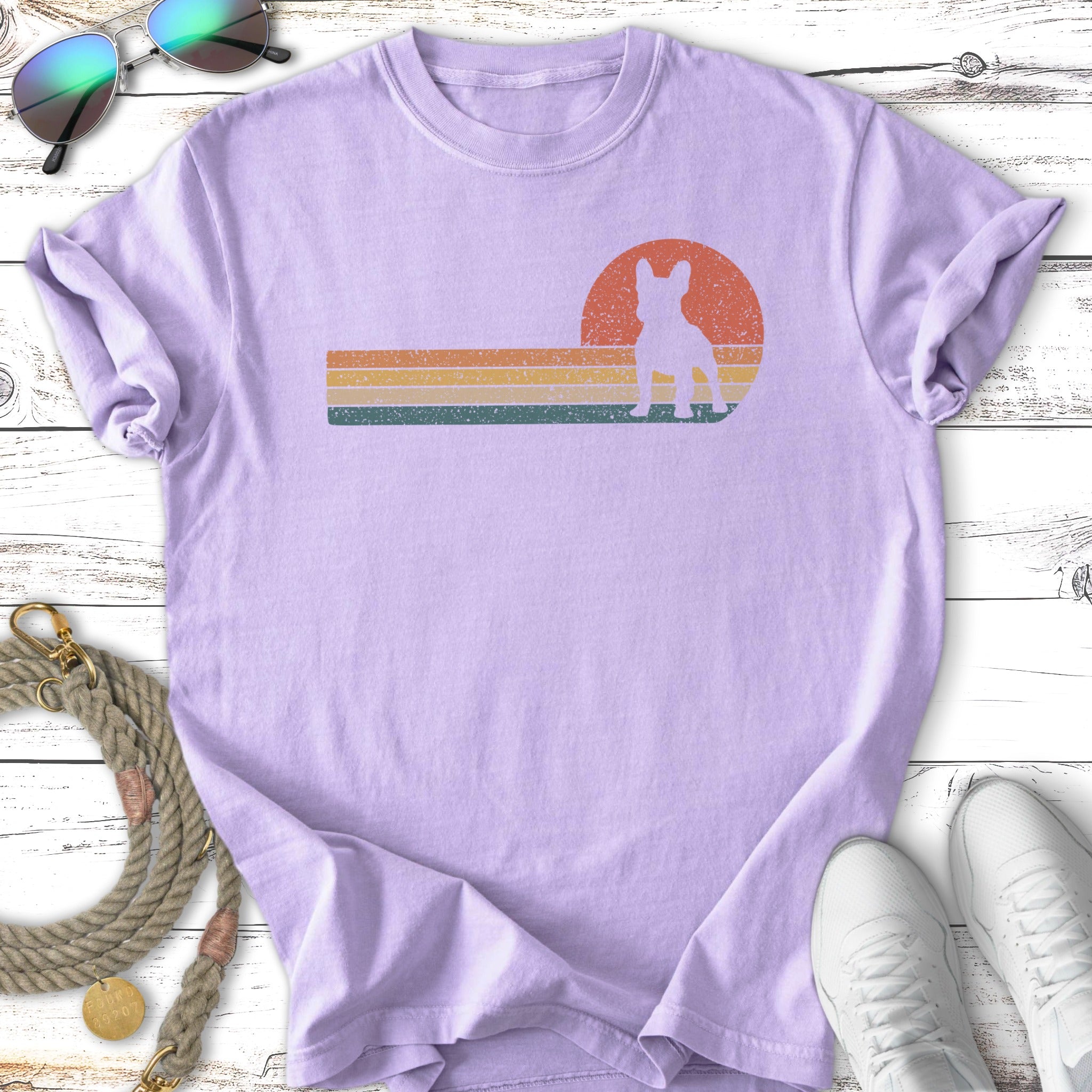 Lavender t-shirt with a vintage sunset graphic and a French bulldog silhouette.