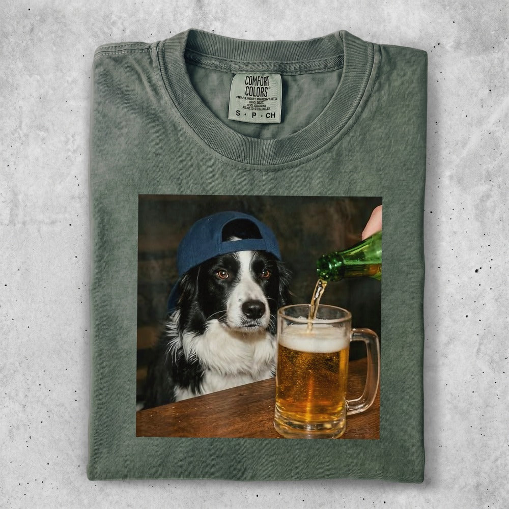 Black and white dog wearing a blue cap, being poured beer into a mug.