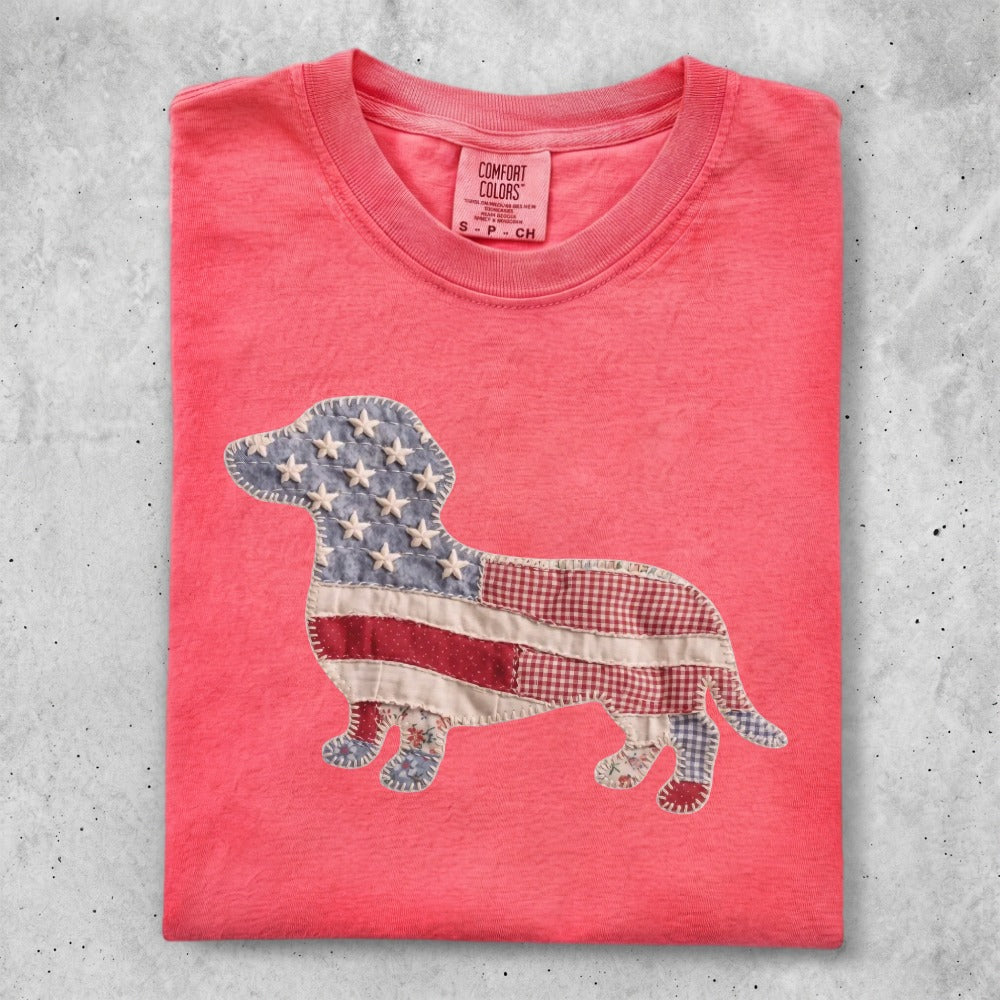 Coral t-shirt with a patriotic patchwork dachshund graphic.