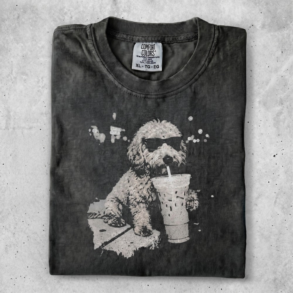 T-shirt featuring a cartoon dog wearing sunglasses drinking from a large iced coffee.