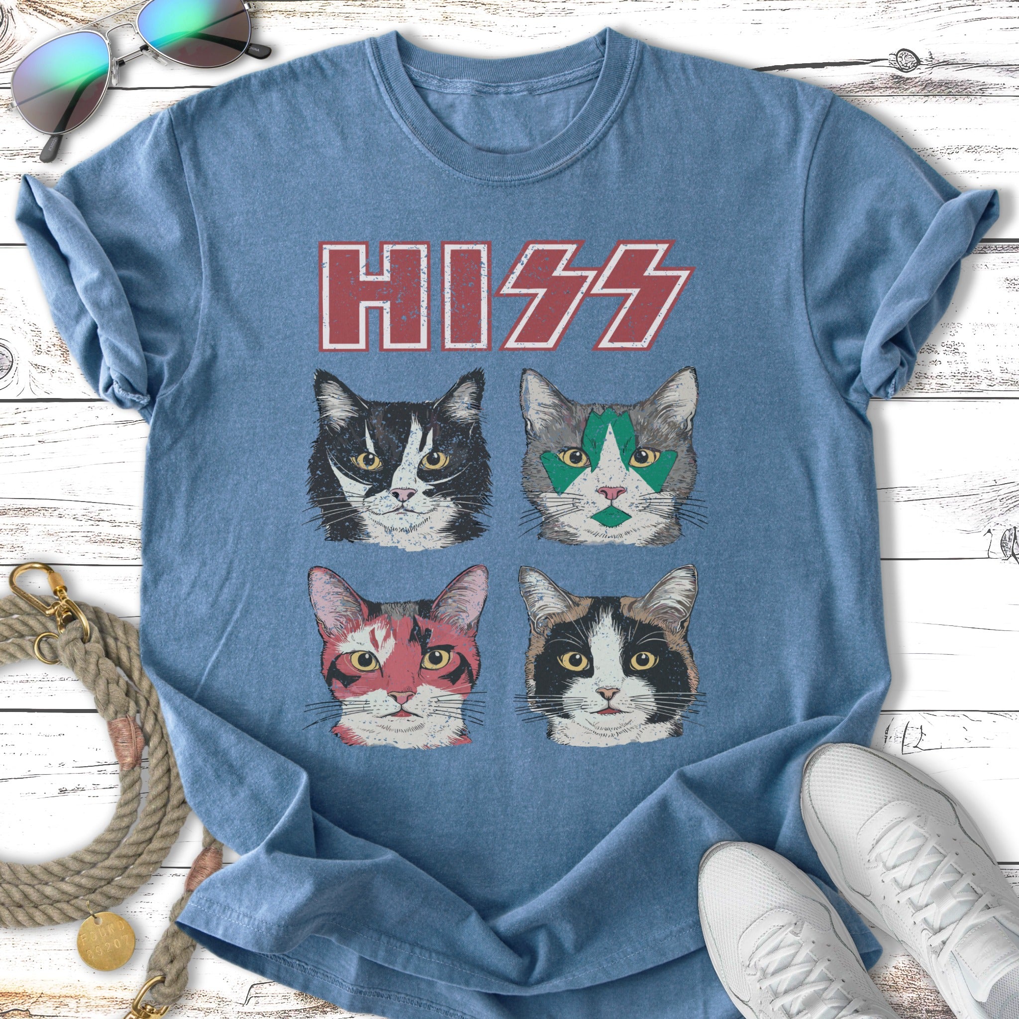 T-shirt with four cat faces in rock band makeup, text "HISS".