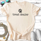 Cream t-shirt with "treat dealer" text and a paw print.