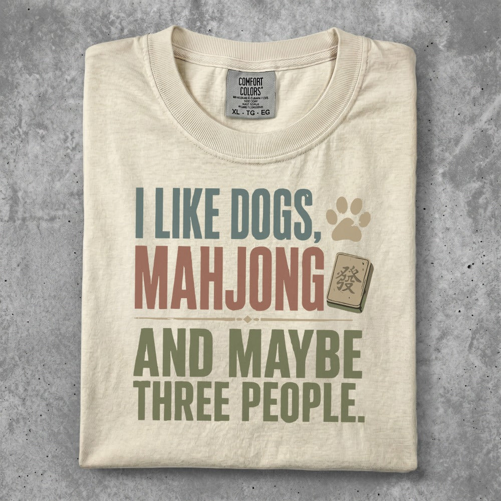 Cream t-shirt with "I Like Dogs, Mahjong, and Maybe Three People" text.