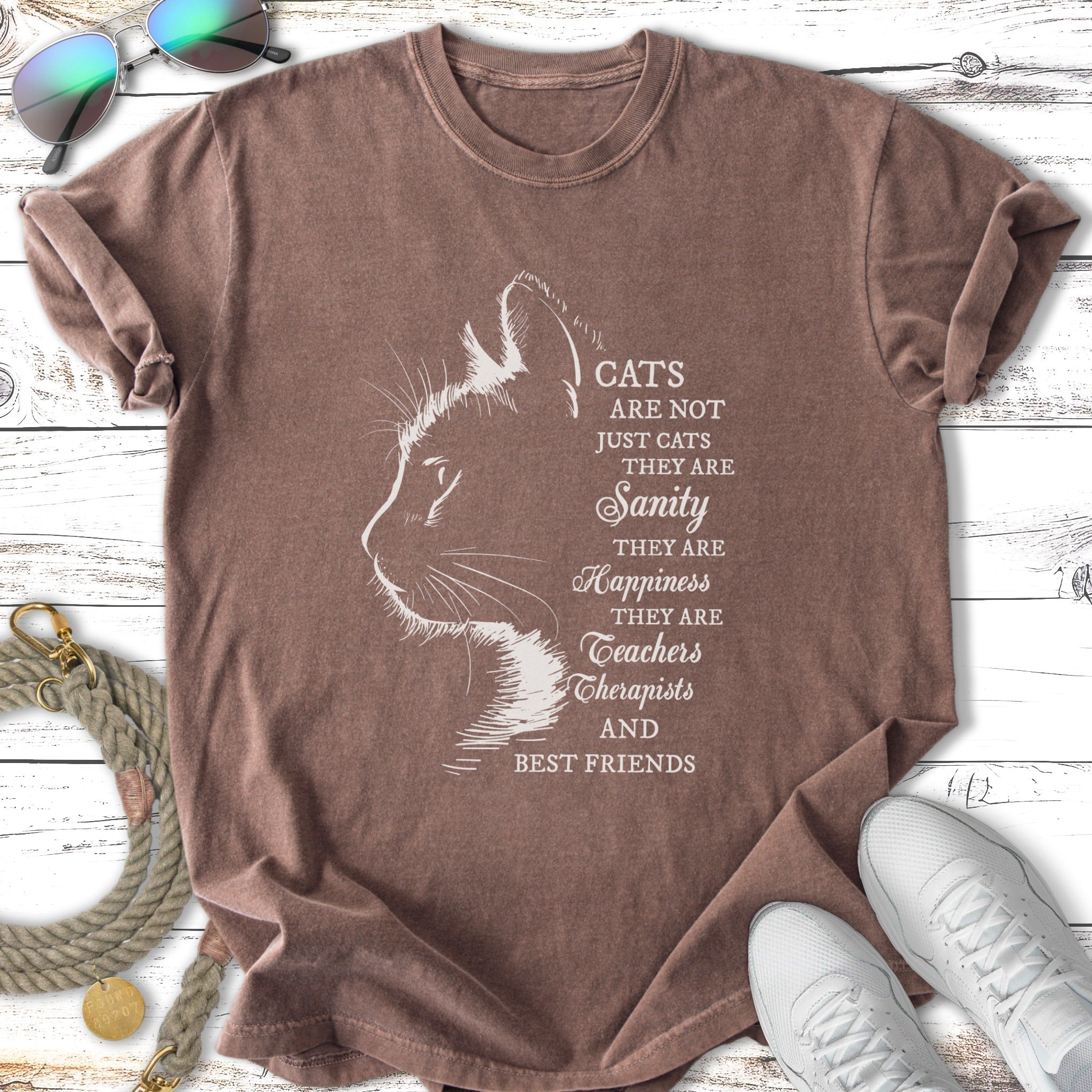T-shirt with white silhouette of a cat and text about cats being sanity and happiness.