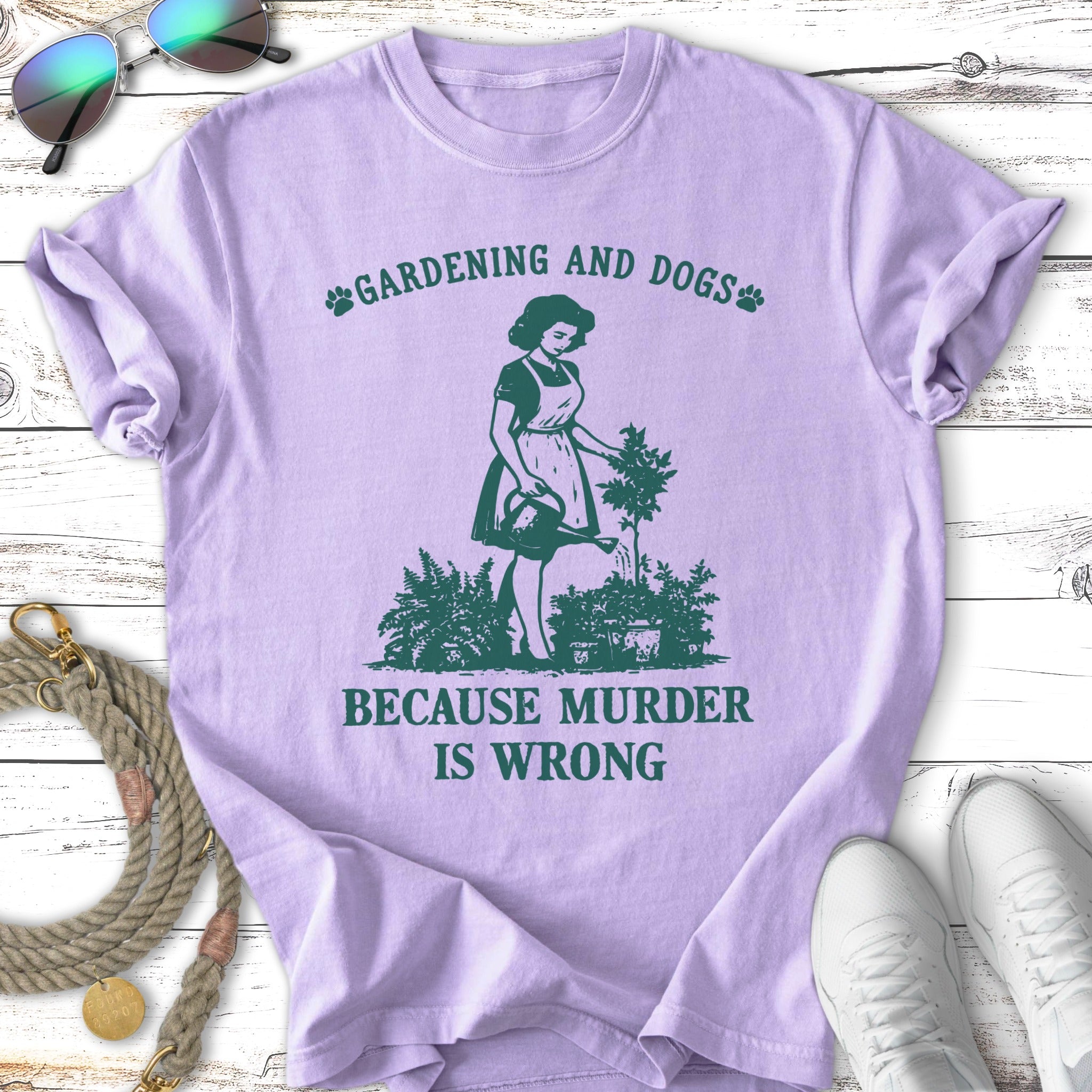 Purple t-shirt with "Gardening and Dogs, Because Murder is Wrong" and graphic.