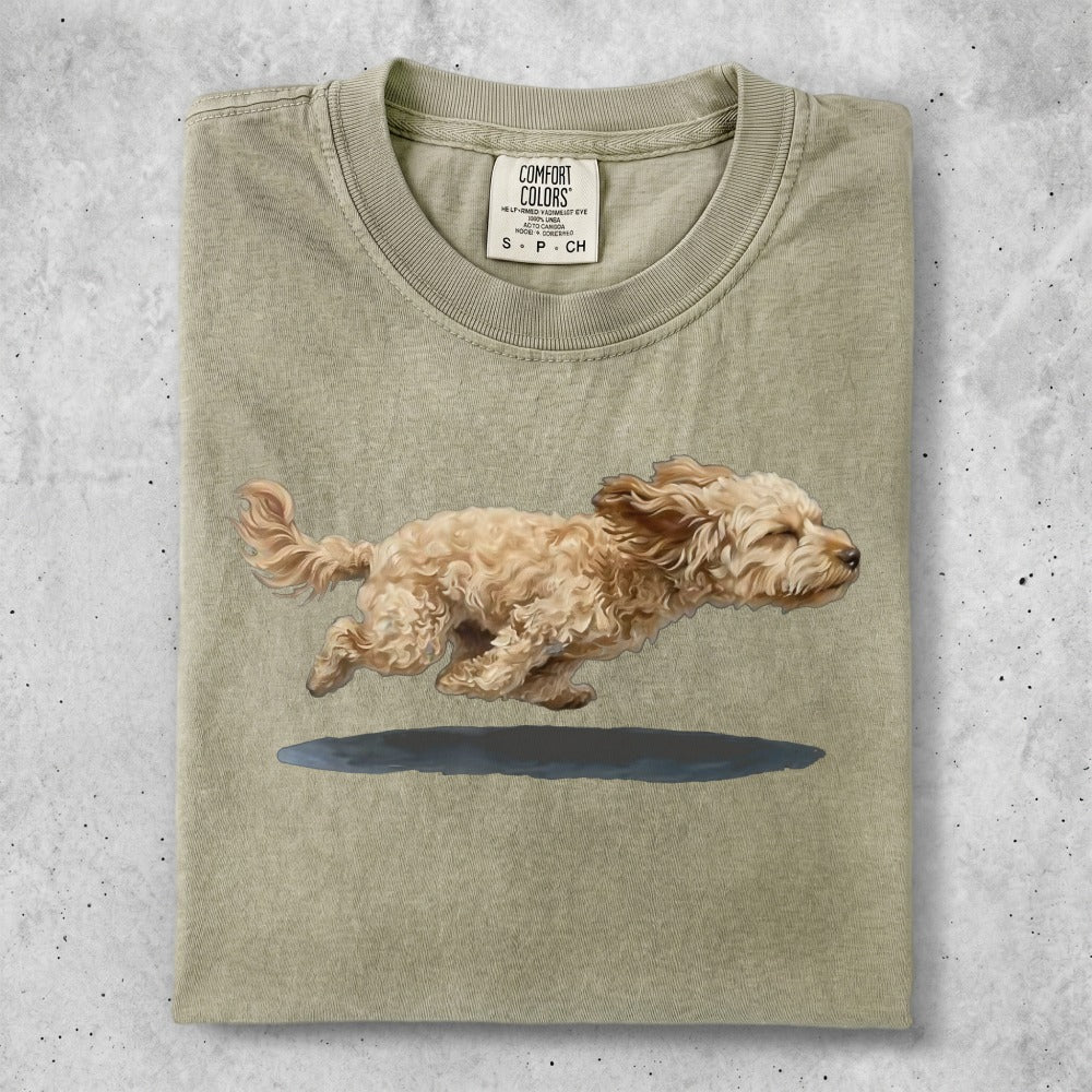 Light brown dog running, with Comfort Colors logo on shirt.