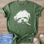 Green t-shirt with white graphic of a shaggy dog face holding a cigarette.