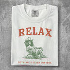 White t-shirt with "RELAX" and a seated figure.