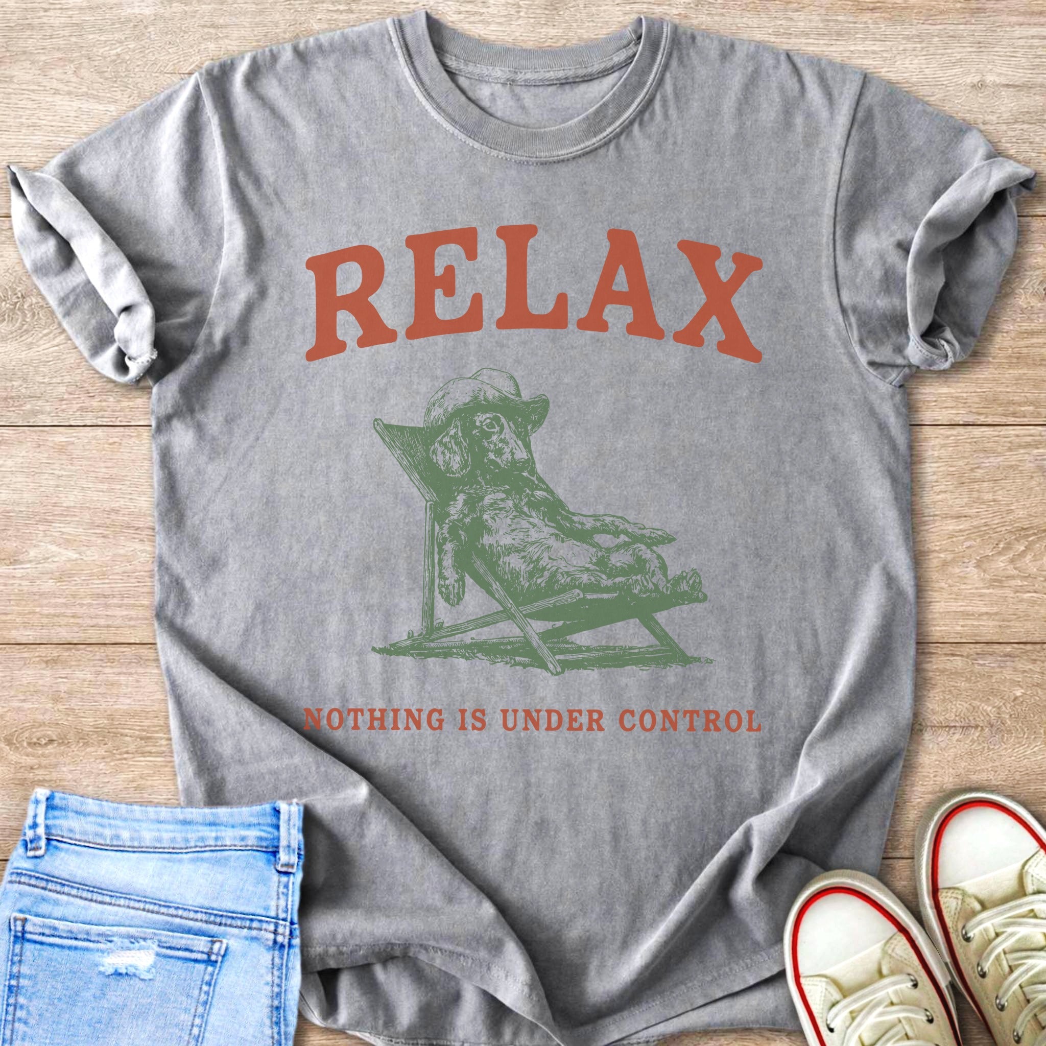 Gray t-shirt with text "RELAX" and a dog in a lounge chair.
