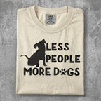 Cream t-shirt with black silhouette of dog and text "LESS PEOPLE MORE DOGS".
