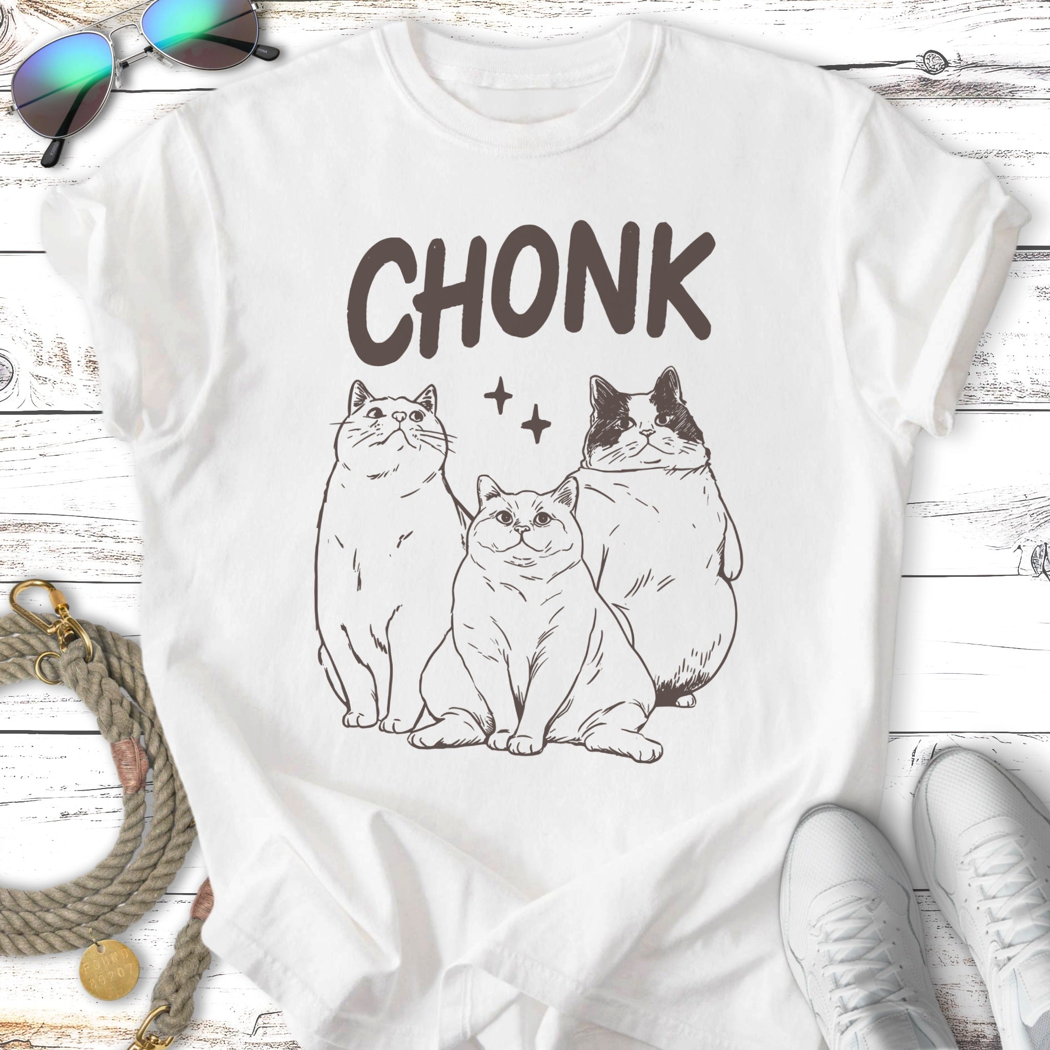 Three cartoon cats, two thin and one large, with "CHONK" text above.