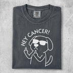 Dog wearing sunglasses gives middle finger with text "HEY CANCER!".