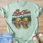 Mint green t-shirt with distressed graphic of two golden retrievers in life vests on a lake.