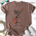 T-shirt with a cartoon pug playing a red electric guitar.