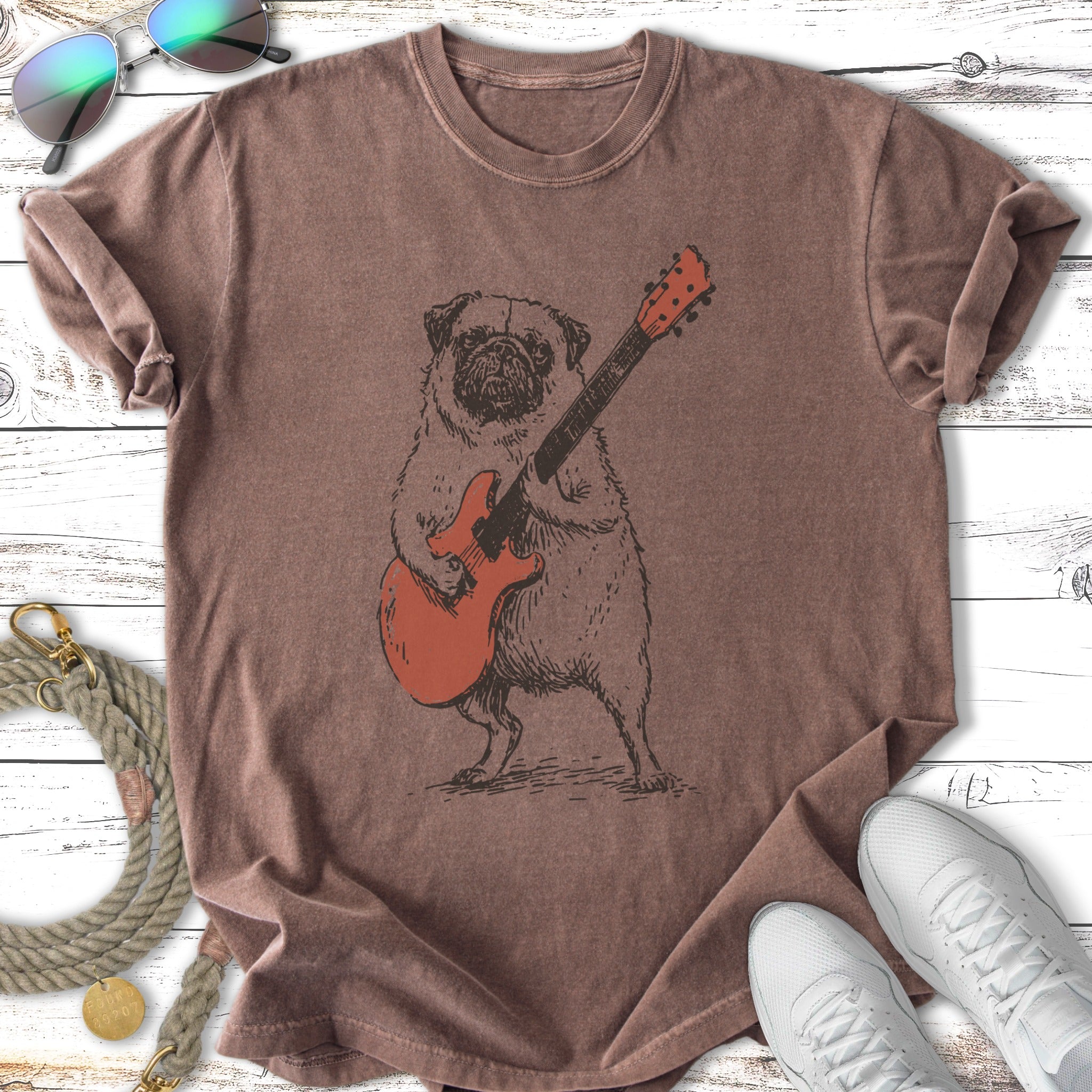 T-shirt with a cartoon pug playing a red electric guitar.