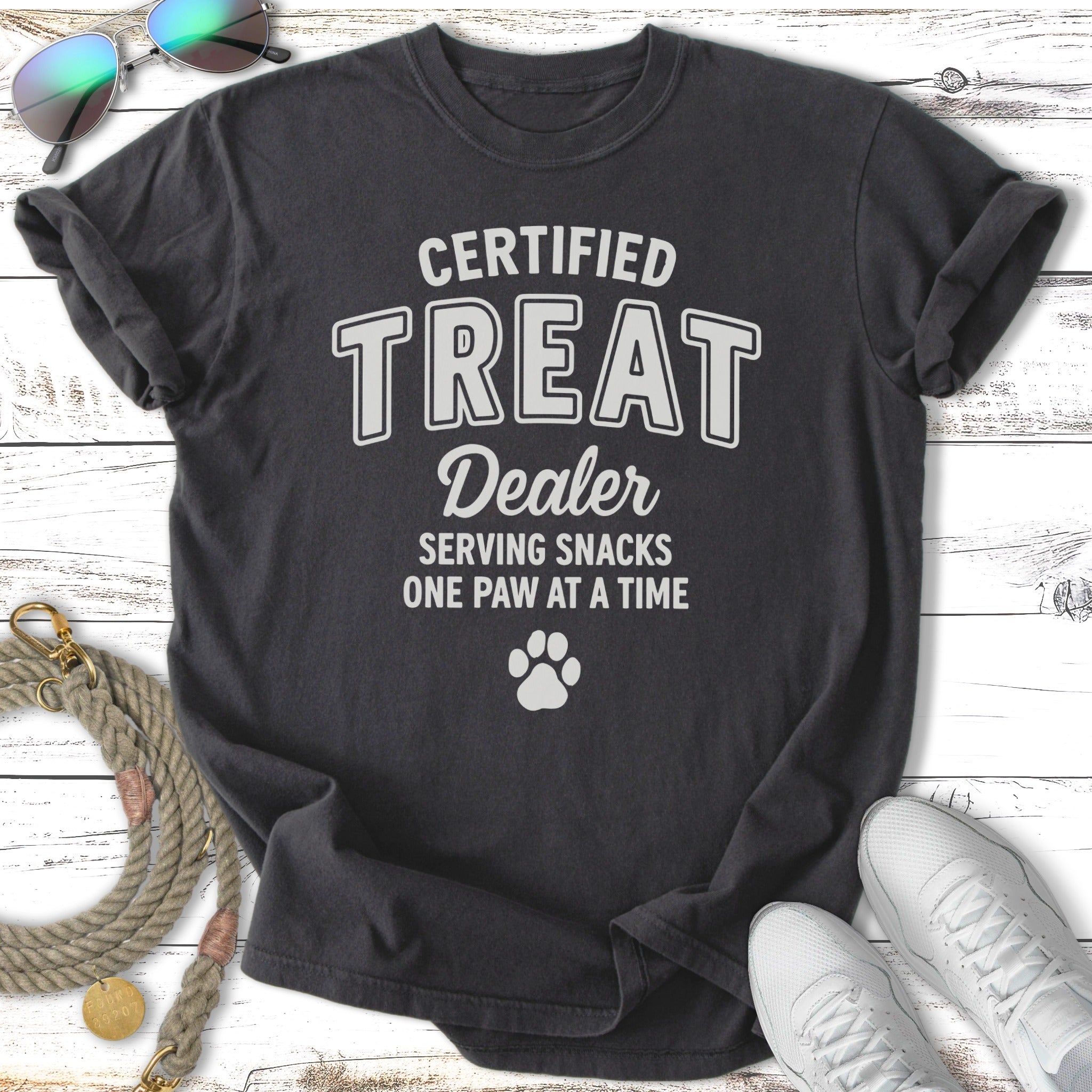 Dark t-shirt with "CERTIFIED TREAT Dealer" and paw print graphic.