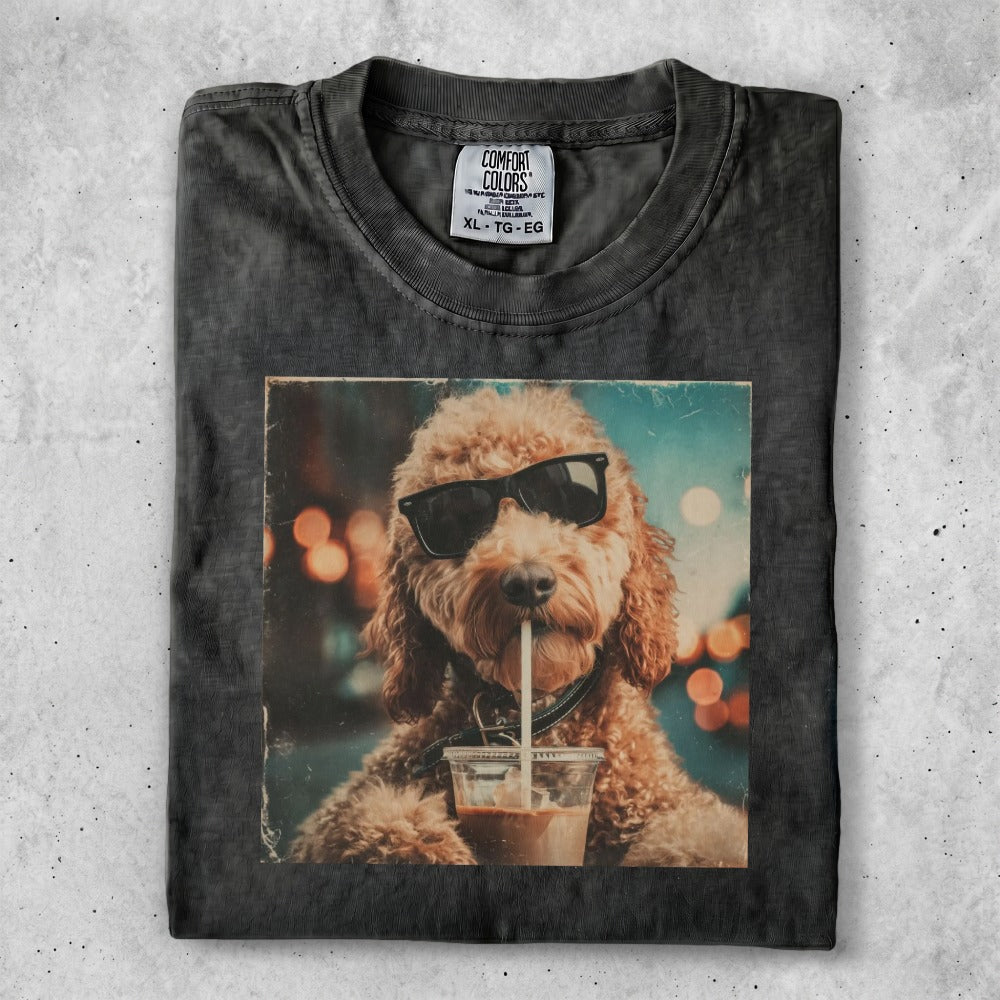 Dog wearing sunglasses drinks from a cup.
