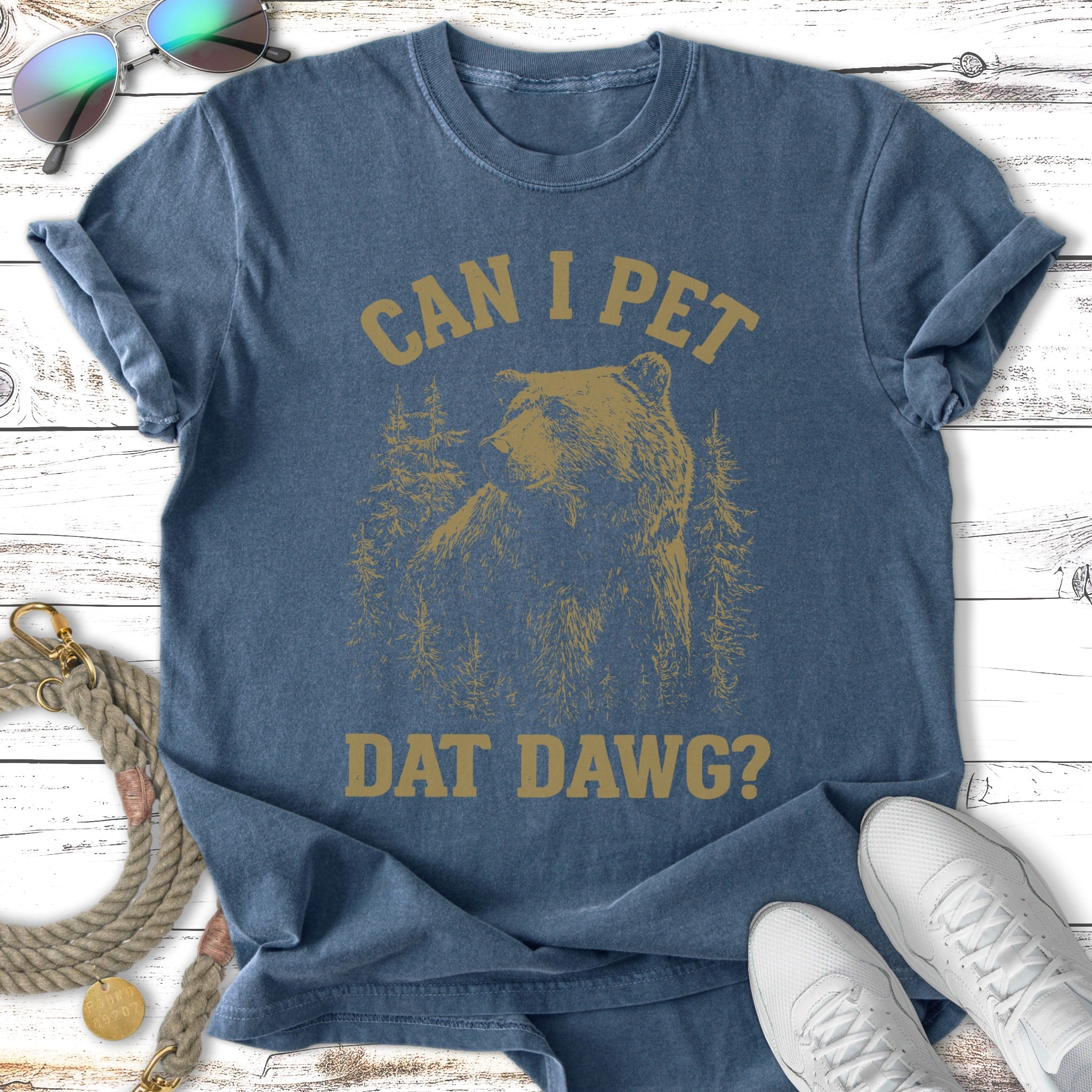 Blue t-shirt with a bear and trees graphic, reads "CAN I PET DAT DAWG?".