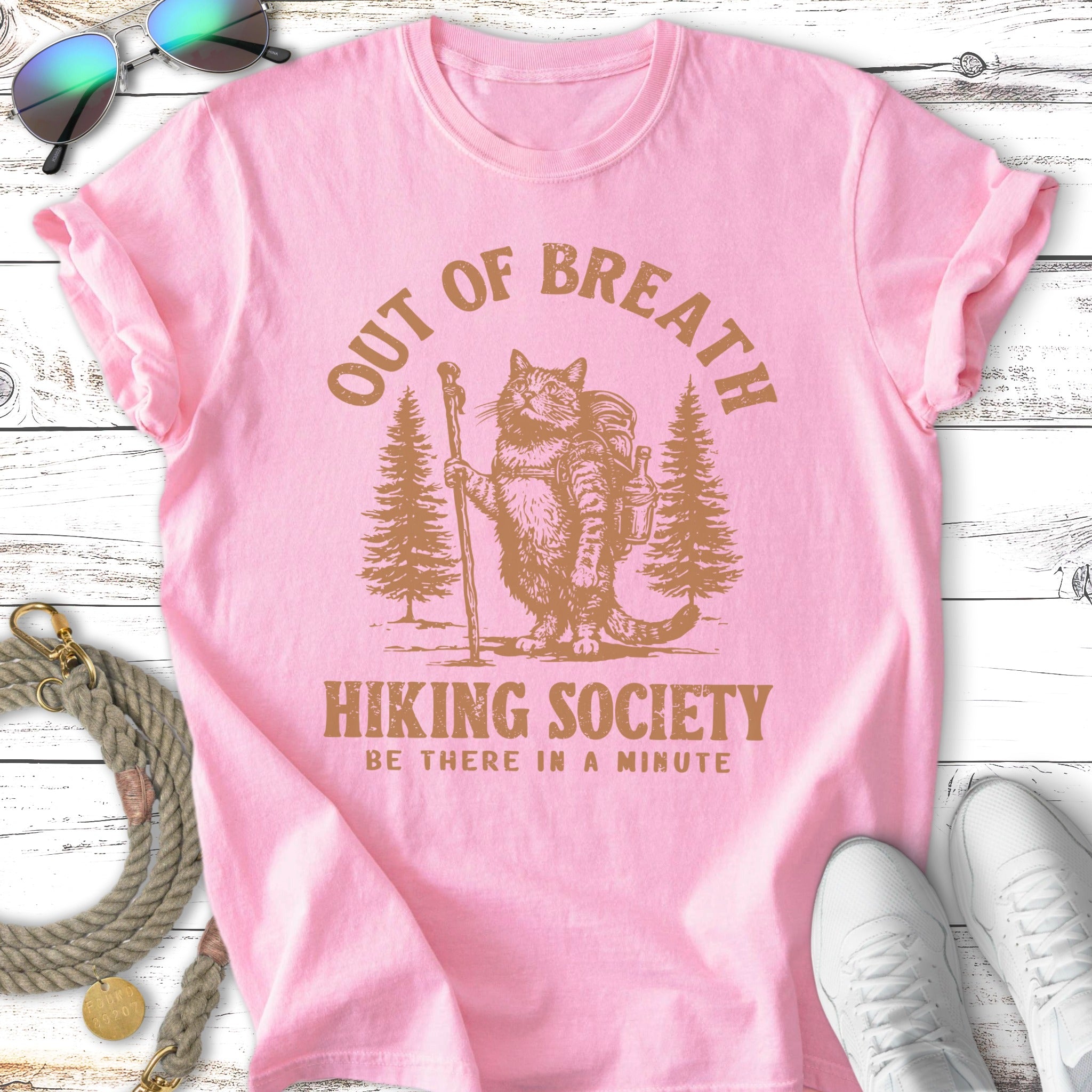 Pink t-shirt with "OUT OF BREATH HIKING SOCIETY" text and a cat hiking.