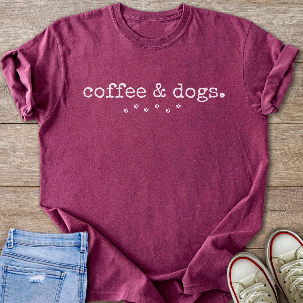 Maroon t-shirt with "coffee & dogs" text and paw prints.