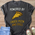 Dark grey t-shirt with text "POWERED BY" and a cheese pizza slice, below "CHEESE PIZZA AND DOGS".