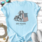 Light blue t-shirt with a dachshund holding an American flag and "250 Years 1776-2026" text.
