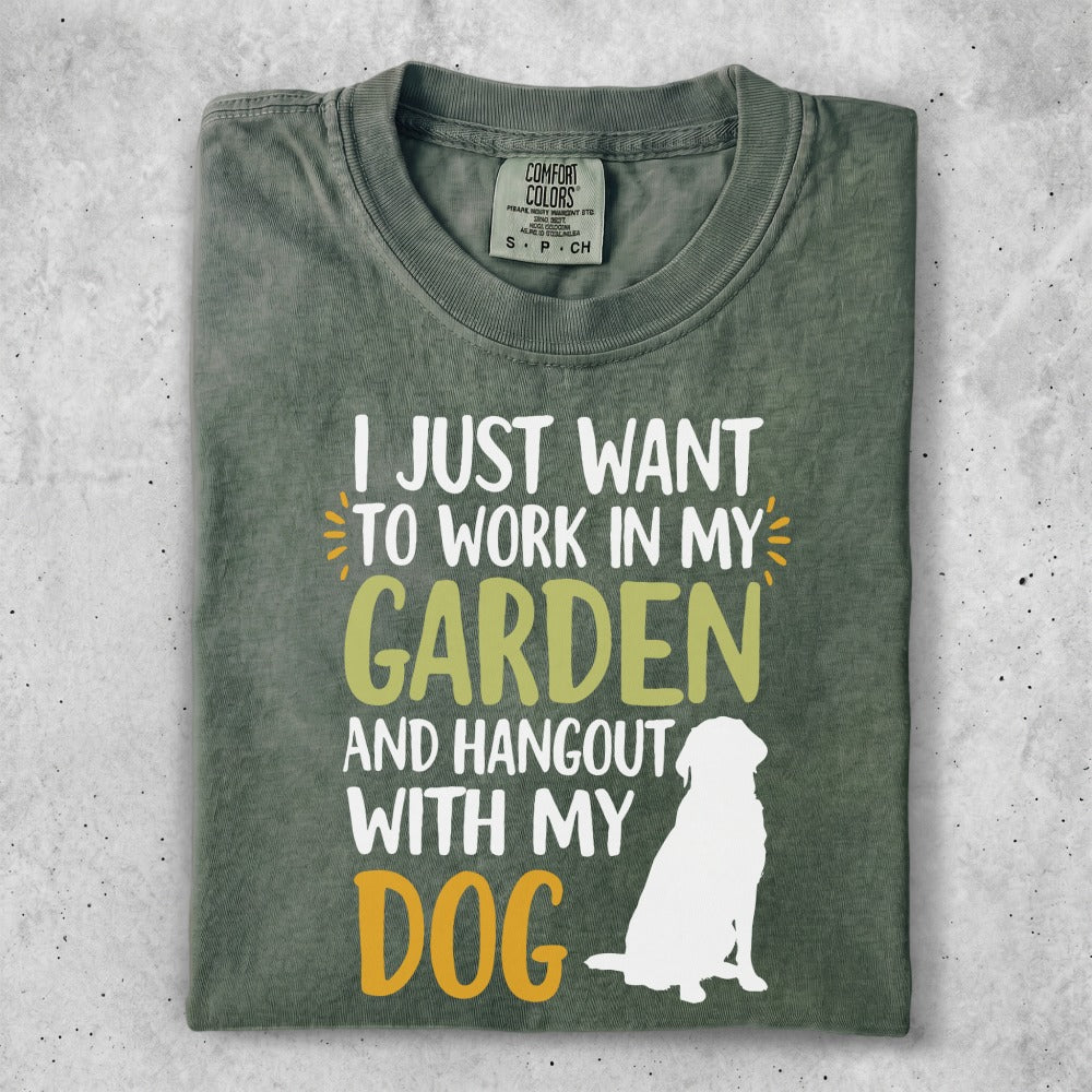 T-shirt with "I just want to work in my garden and hangout with my dog" text and dog silhouette.