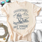 T-shirt with dachshund in sunglasses and hat on skis, text "Mountain Hot Doggin' Ski Resort".