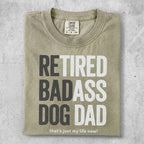 T-shirt with "RETIRED BADASS DOG DAD that's just my life now!" text.