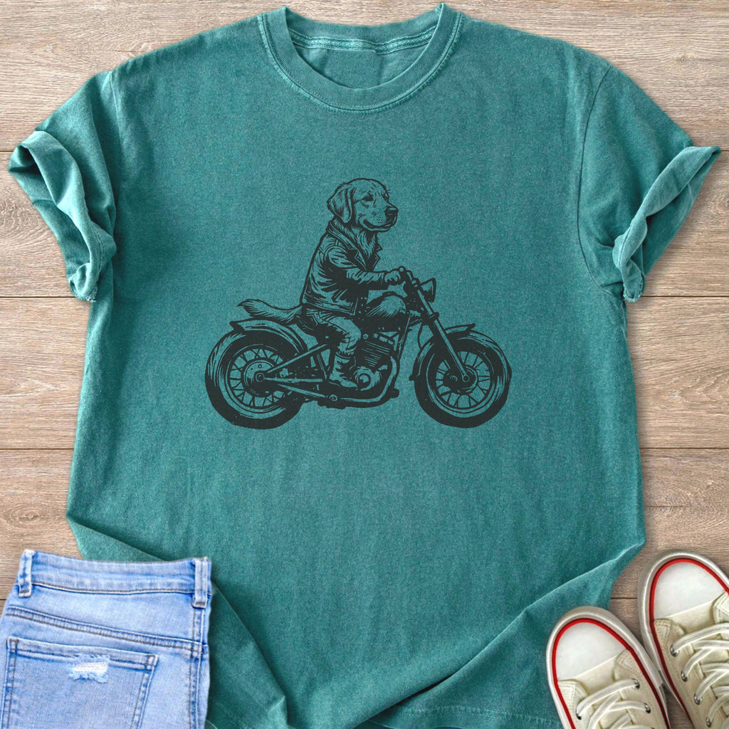 Teal t-shirt with a black graphic of a dog wearing a jacket riding a motorcycle.
