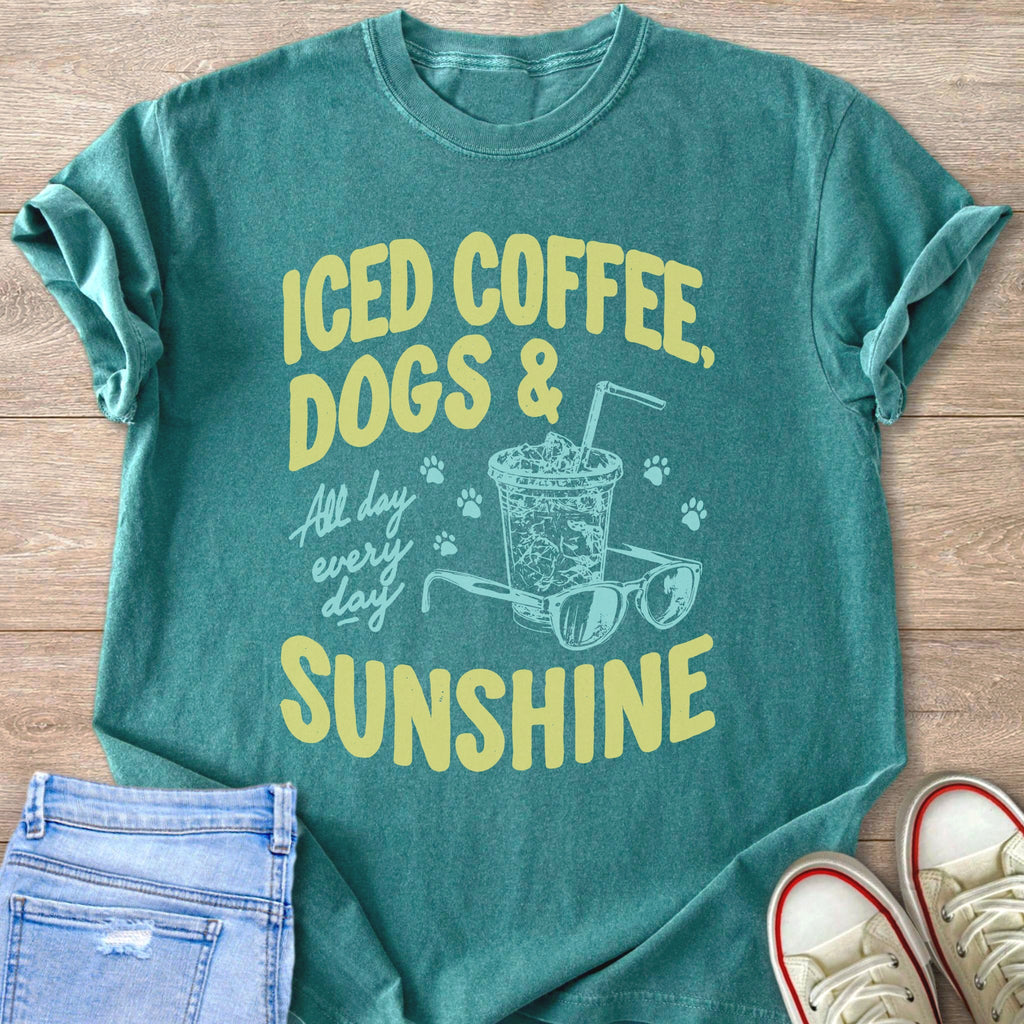 Teal t-shirt with "ICED COFFEE, DOGS & SUNSHINE" graphic and illustrations.