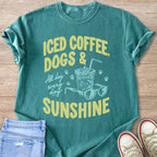 Teal t-shirt with "ICED COFFEE, DOGS & SUNSHINE" graphic and illustrations.