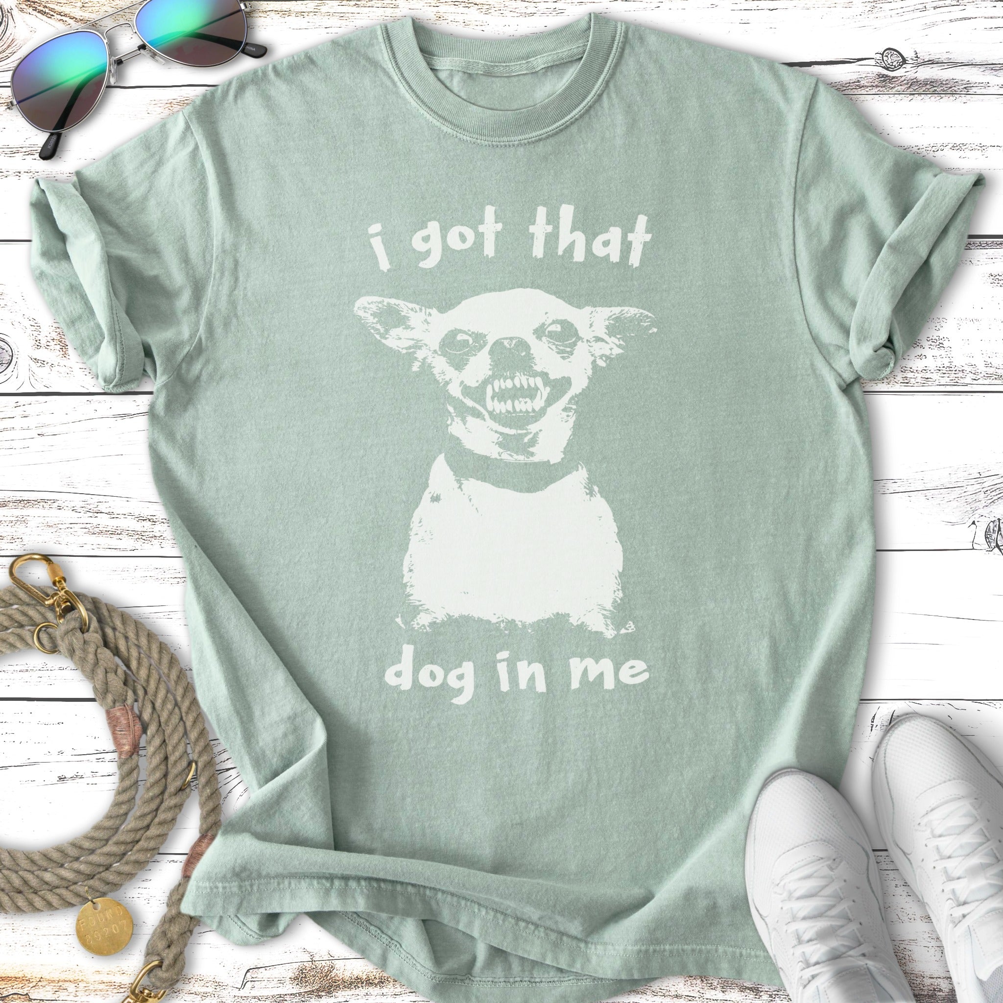 T-shirt with a white graphic of a grinning dog and text "i got that dog in me".