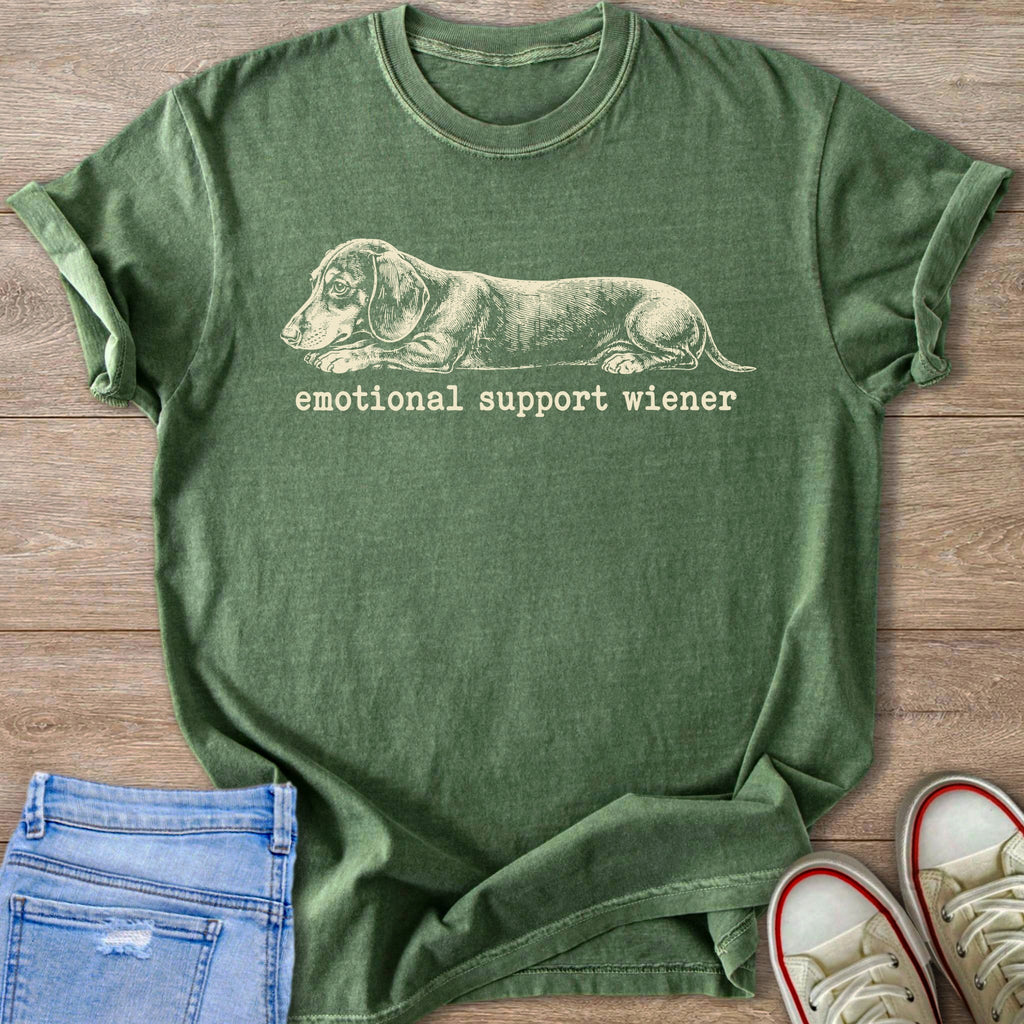 Green t-shirt with a sketch of a dachshund and text "emotional support wiener".